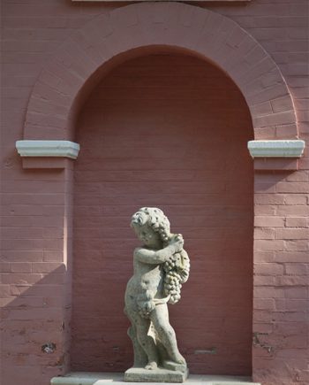Statue en pierre Putti Vignes